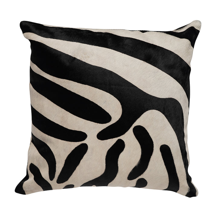 A square-shaped throw pillow with a zebra print pattern in black and white, appears to be made of a natural fiber material.