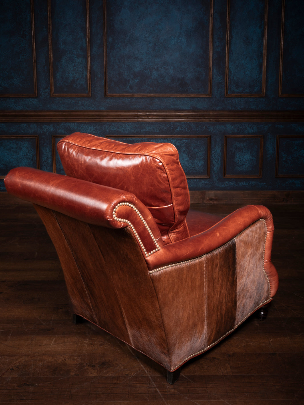 Back view of the Amarillo Red Stitch Accent Chair, showcasing its unique hair-on-hide accents and durable hardwood frame.