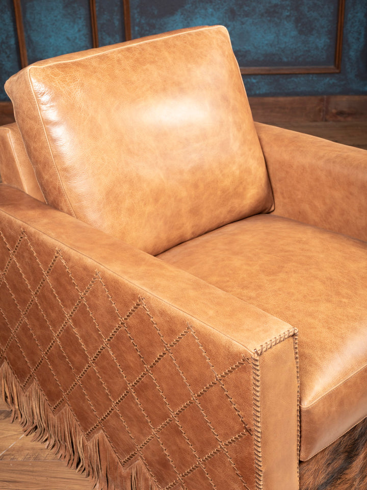 Seat and arm detail of Belmont Laced Leather Swivel Chair in natural tan leather