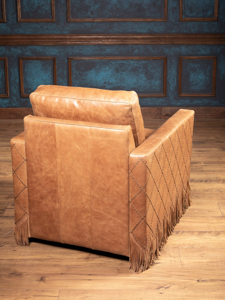 Rear view of Belmont Laced Leather Swivel Chair featuring laced pattern and handcrafted leather fringe