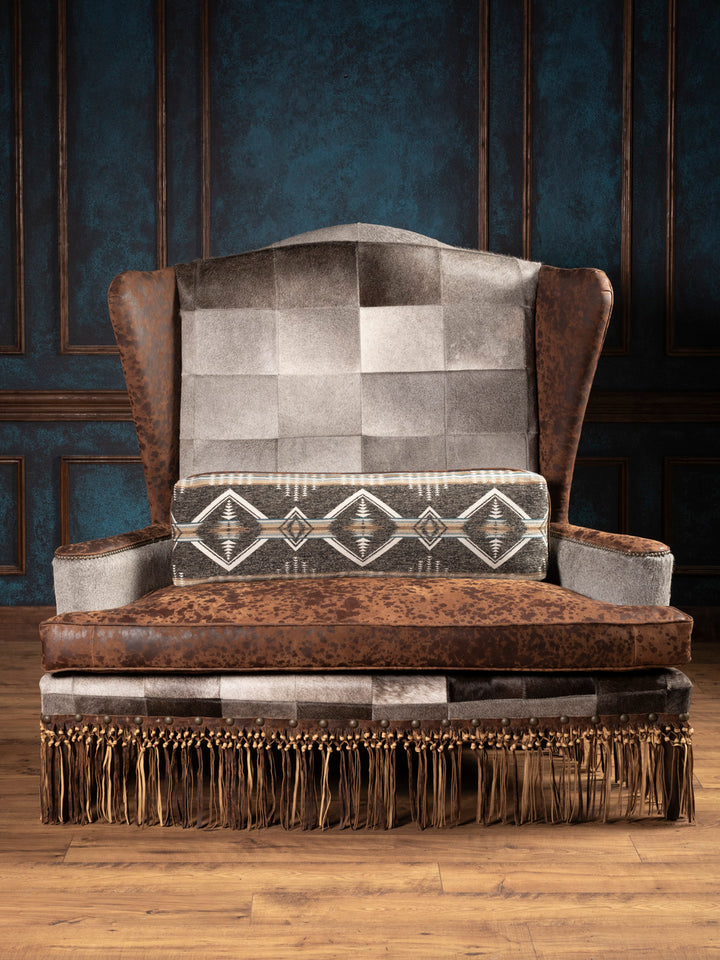 Straight-on view of Canyon Fringe Western Settee showing mixed textures and fringe accents