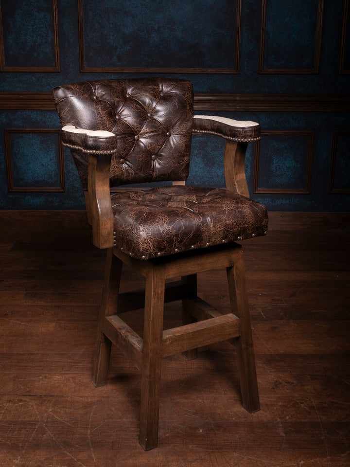 A brown leather bar stool with tufted backrest, solid wooden frame, and 360-degree swivel feature.