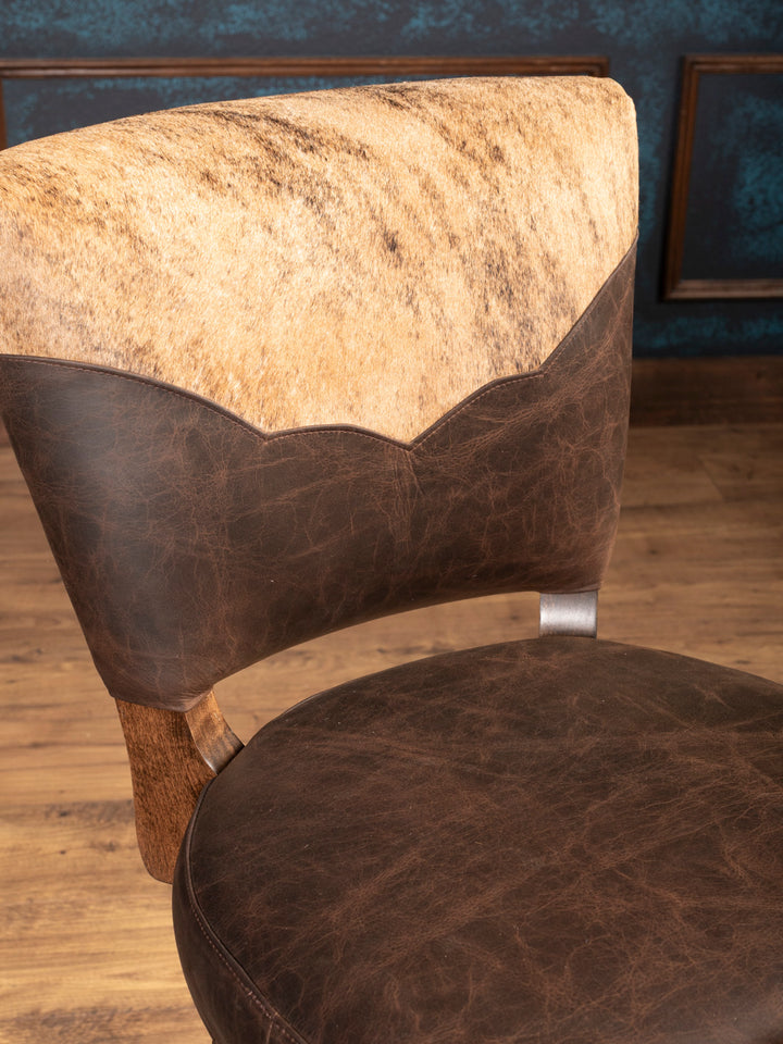 Top Back Detail: Speckled cowhide and distressed leather backrest with Western scalloped edge design