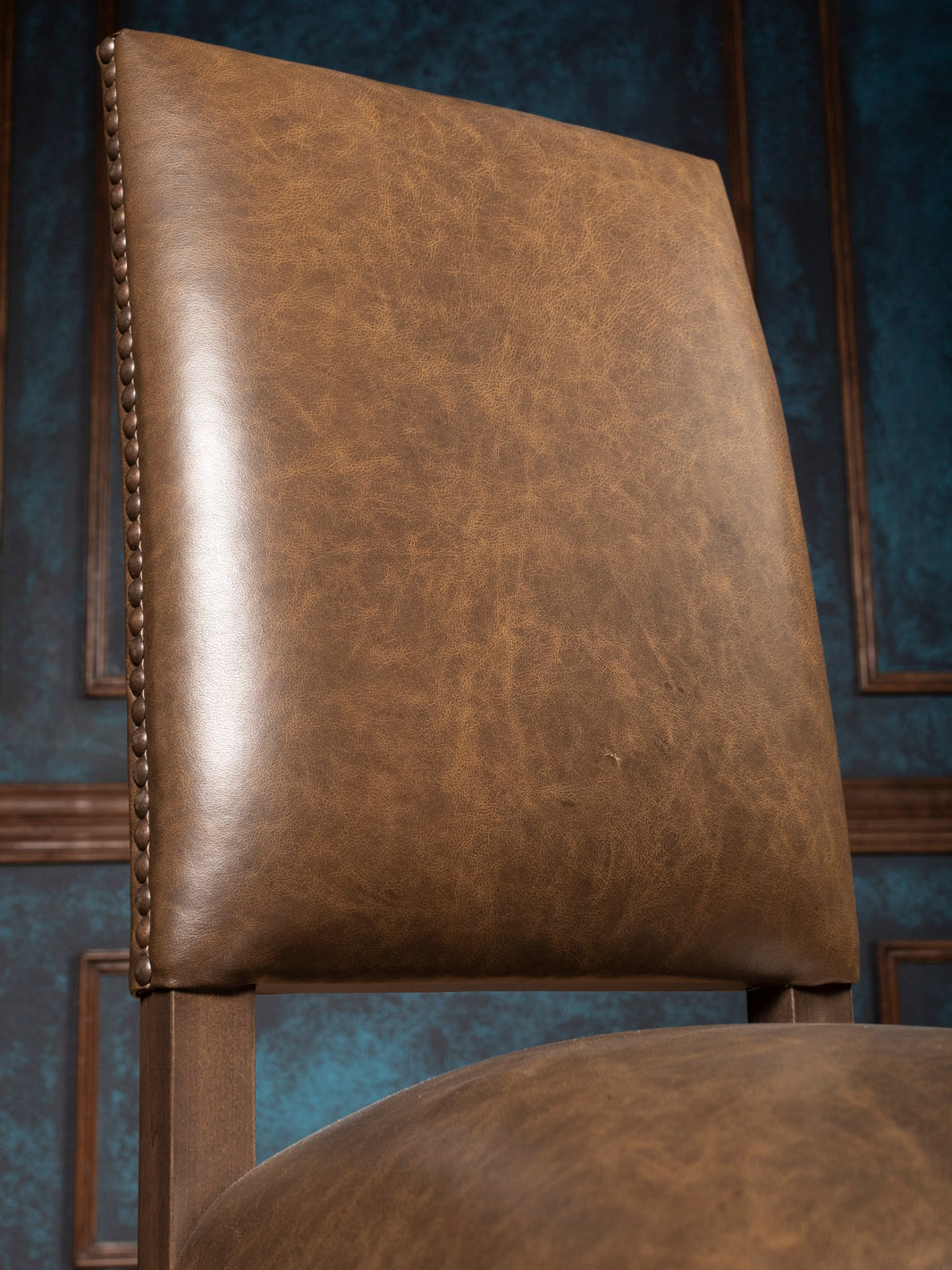 Close-up of brown full-grain leather backrest with smooth texture