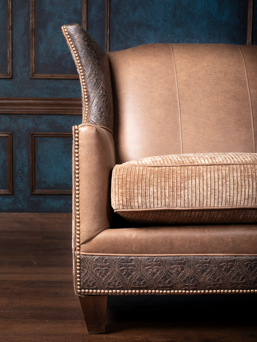 Side view of the Hazelnut Leather Settee showcasing the luxurious full-grain leather and embossed Gateway Walnut leather with a sturdy wood frame.