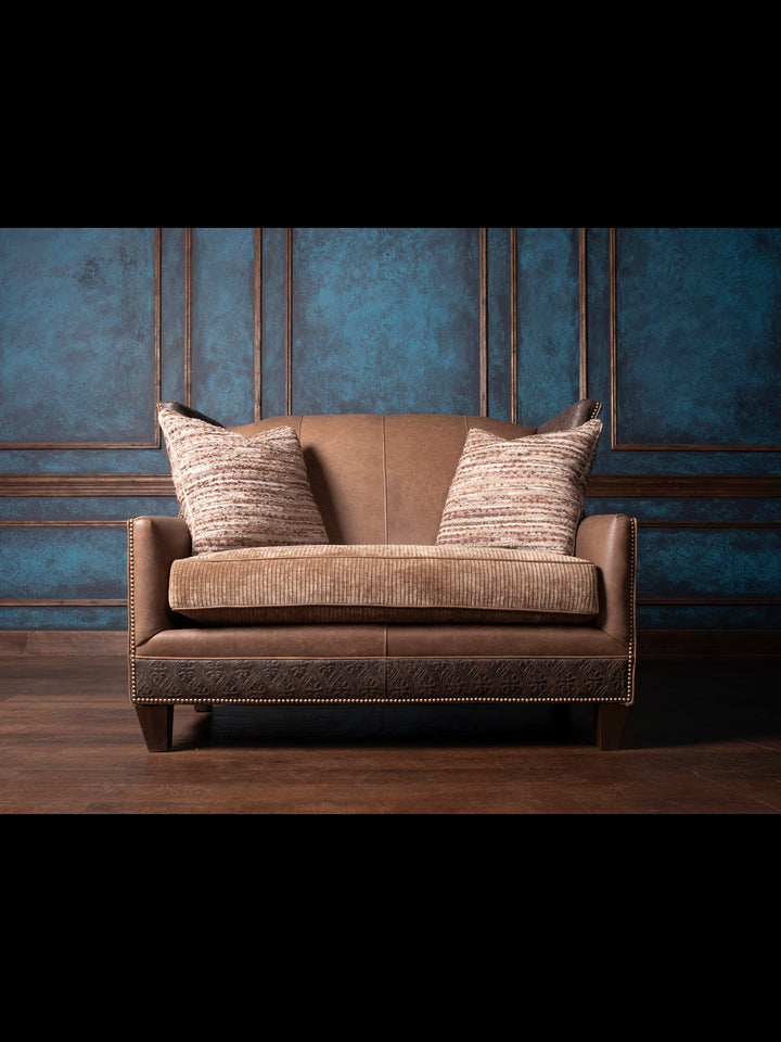 Front view Hazelnut Leather Settee showcasing premium full-grain Rustler leather in a rich Hazelnut color, with unique hair-on-hide accents and a solid wood frame