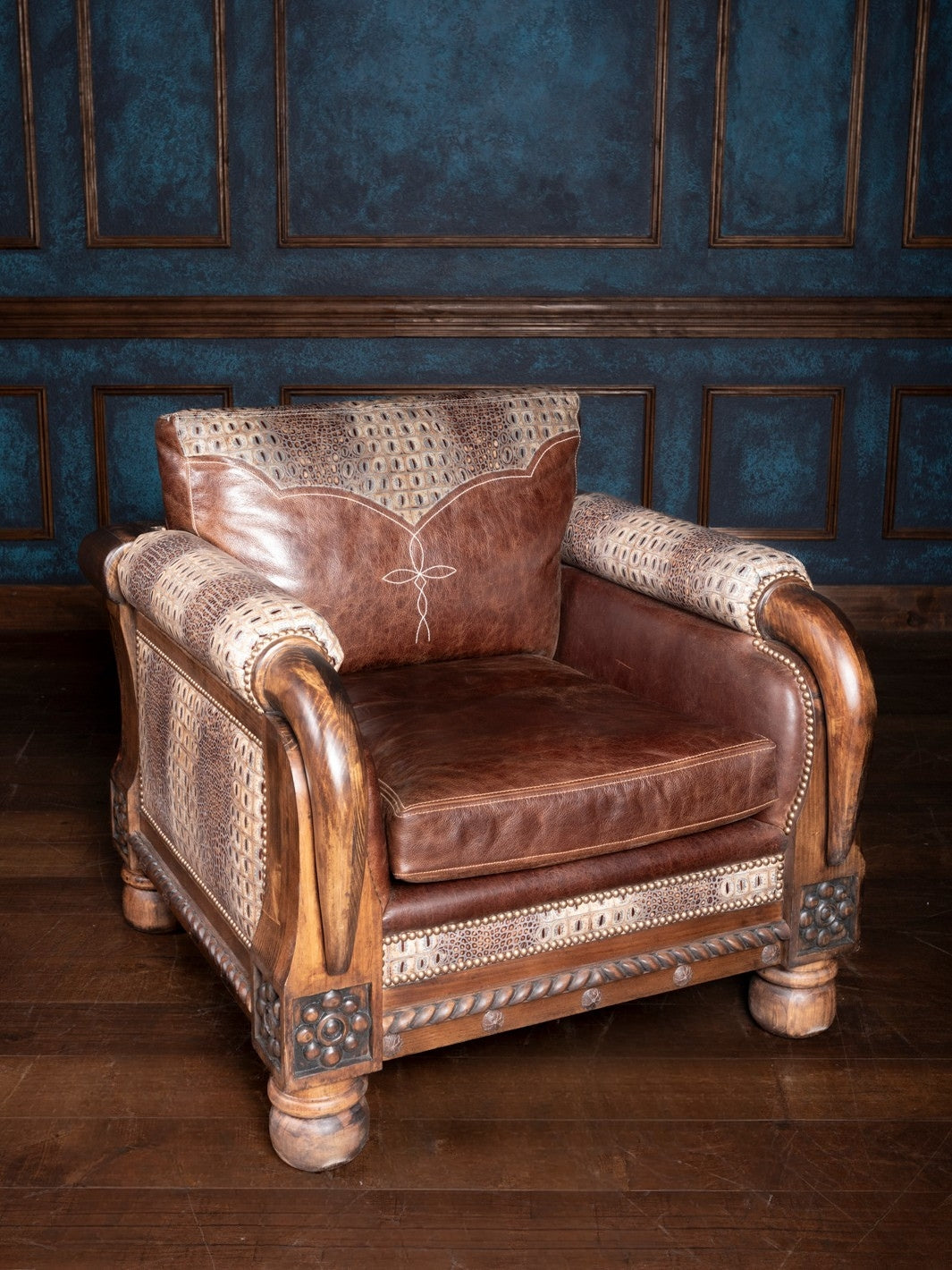 Side view of the Lone Star Stitch Leather Accent Chair, showcasing its rich brown leather upholstery with intricate stitching details and carved wooden armrests.