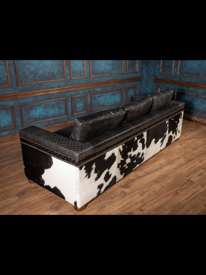 Back view of sofa with full cowhide paneling