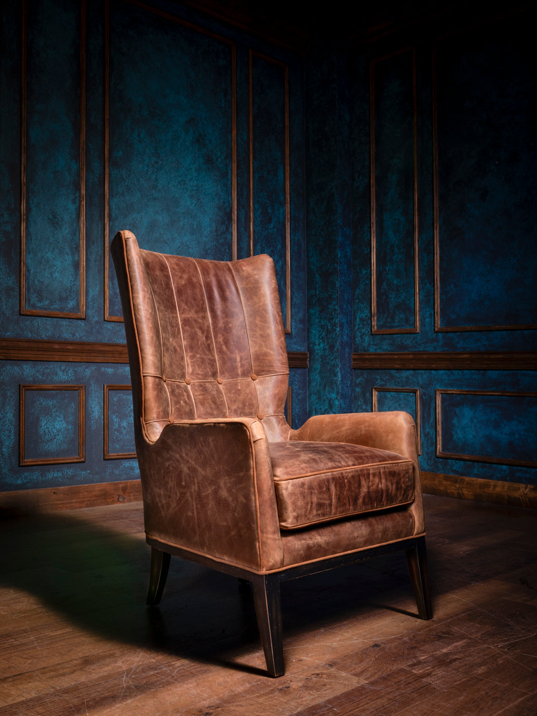 Front view of the Rustic Sycamore Leather Accent Chair, showcasing its full-grain Sycamore leather upholstery, intricate quilted stitching, and rustic ranch design