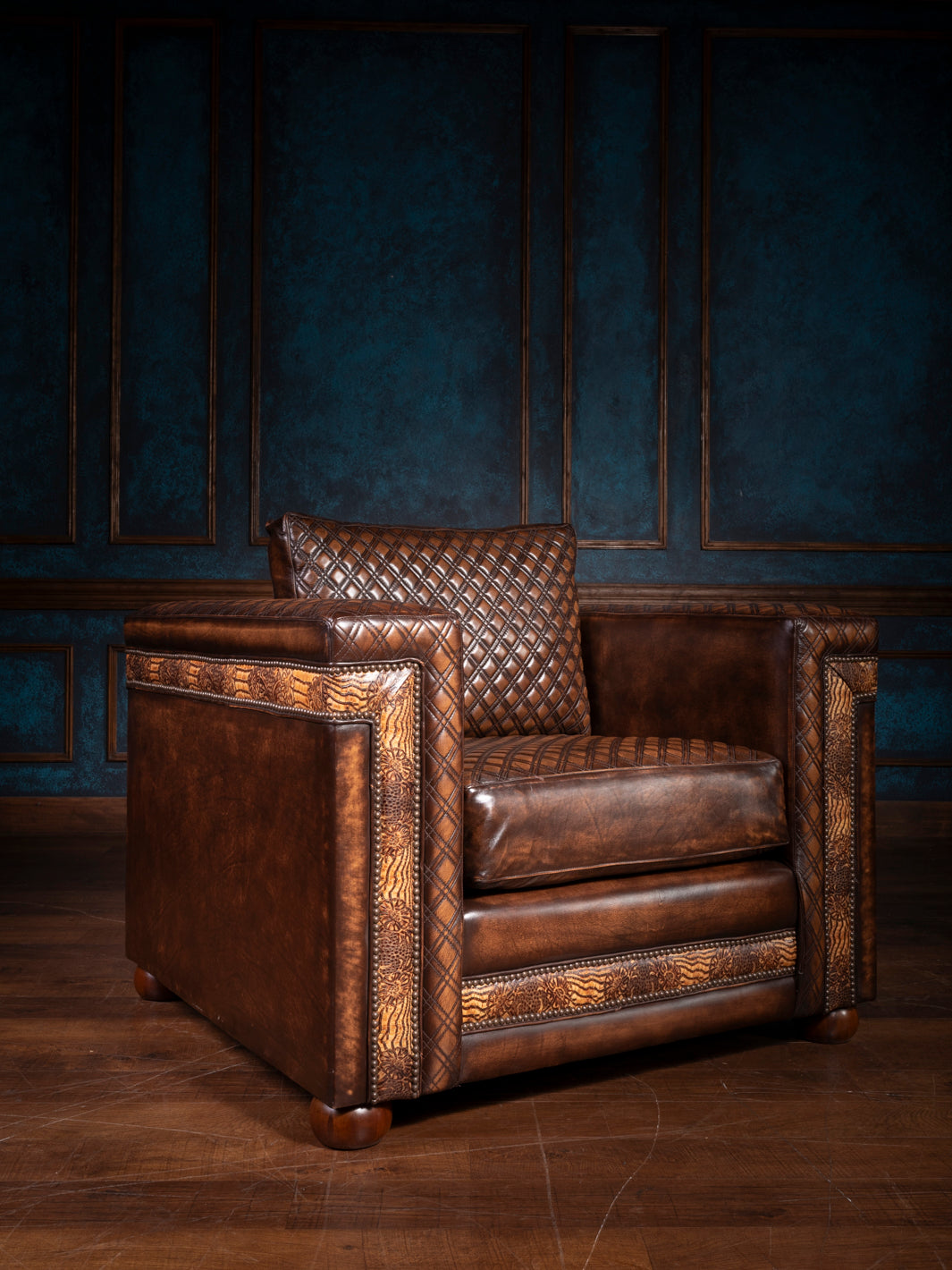 Rodeo quilted leather accent chair in rich brown tones, featuring a bold diamond-stitched seat and backrest, framed with hand-tooled leather panels and nailhead trim for a Western artisan finish.