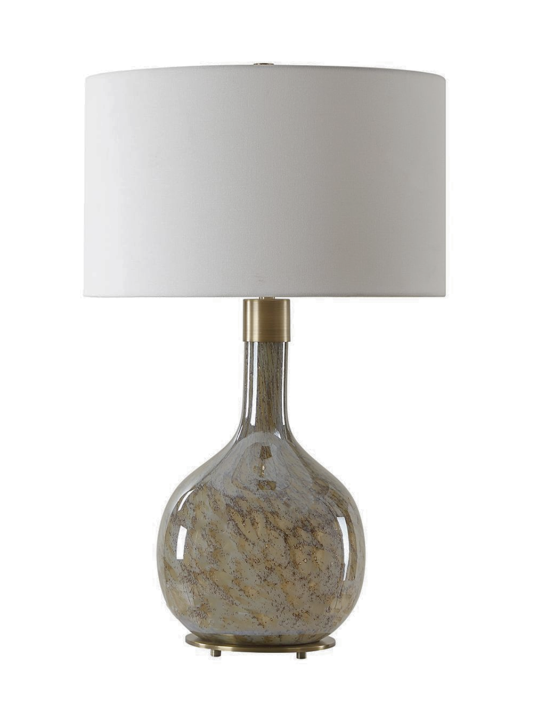 A decorative table lamp with a rounded glass base featuring swirling earthy tones of beige and brown, topped with a white fabric drum shade and a brass accent near the neck