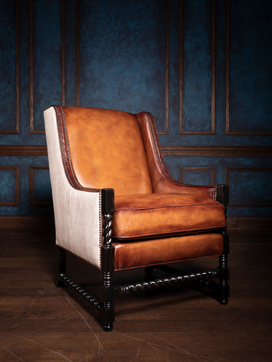 Luxury handcrafted Savannah Leather & Croc Accent Chair with hand-burnished Toro saddle leather and embossed cream crocodile leather accents, featuring a solid wood frame with twisted legs and a striking contrast.