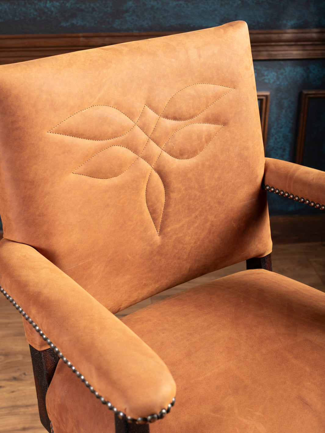 Close-up of boot stitch design on backrest of Sedona Saddle Leather Bar Stool