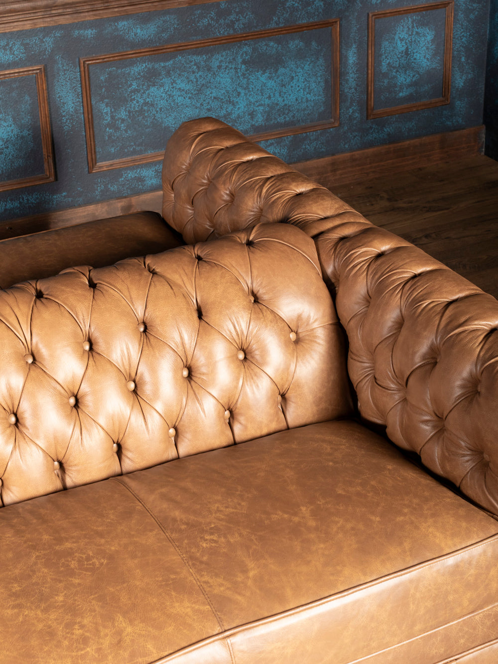 Tufted backrest and leather seating close-up