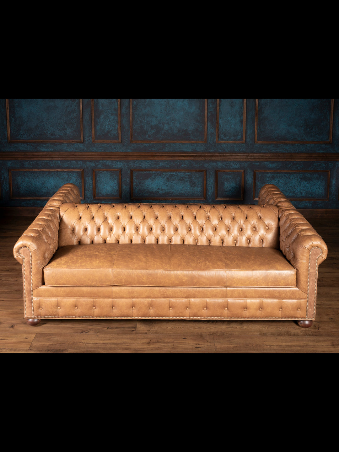 Top-down angle of the tufted leather sofa