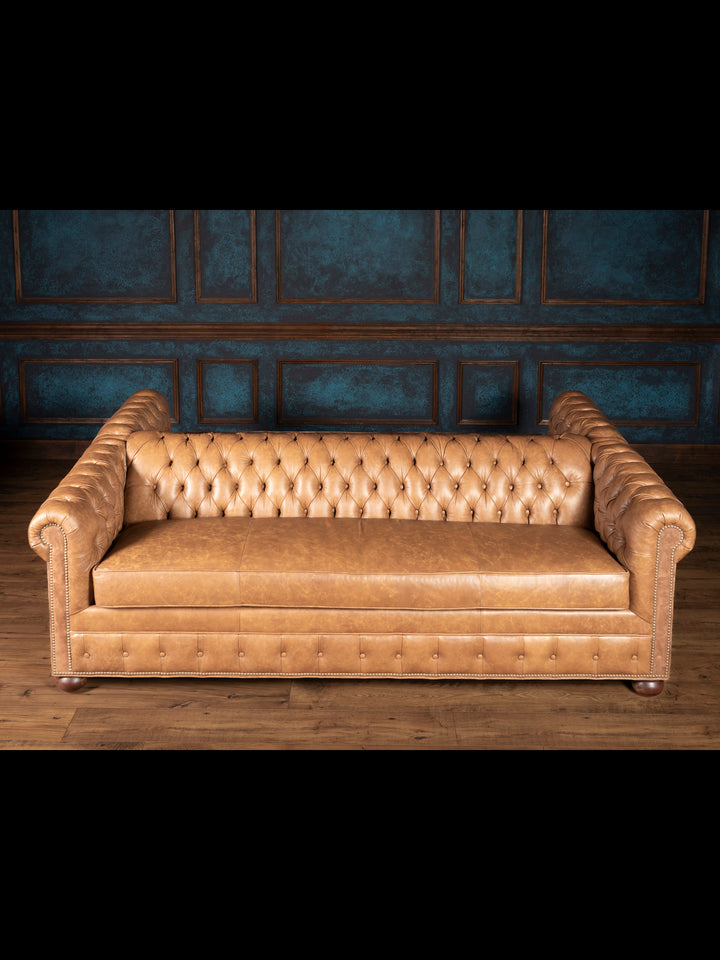 Top-down angle of the tufted leather sofa
