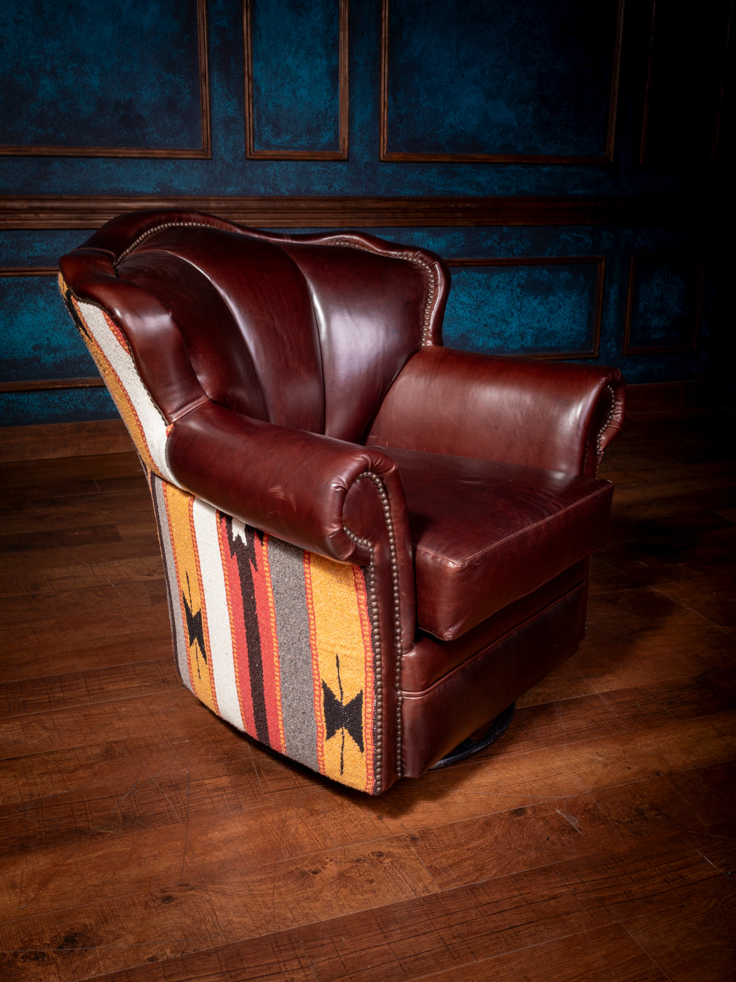 upper angle front side view of adobe leather swivel chair leather and aztec design