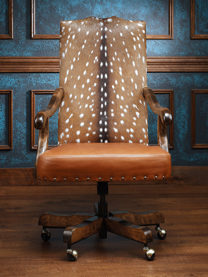 Whiskey Axis Hide Desk Chair with leather seat, wooden frame, and wheels, offering a sleek, rustic design for luxurious seating.