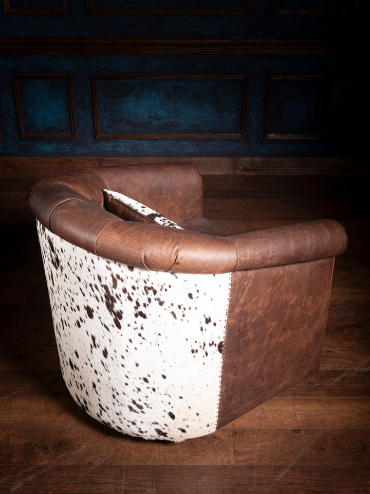 Back view of Bison Ridge leather swivel chair highlighting intricate leather craftsmanship and hair-on-hide detailing.