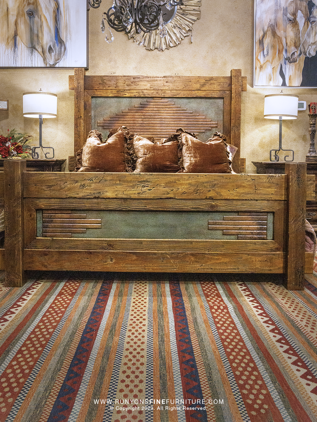 Wooden copper bed with decorative pillows in a bedroom setting, featuring a striped rug and wall art.