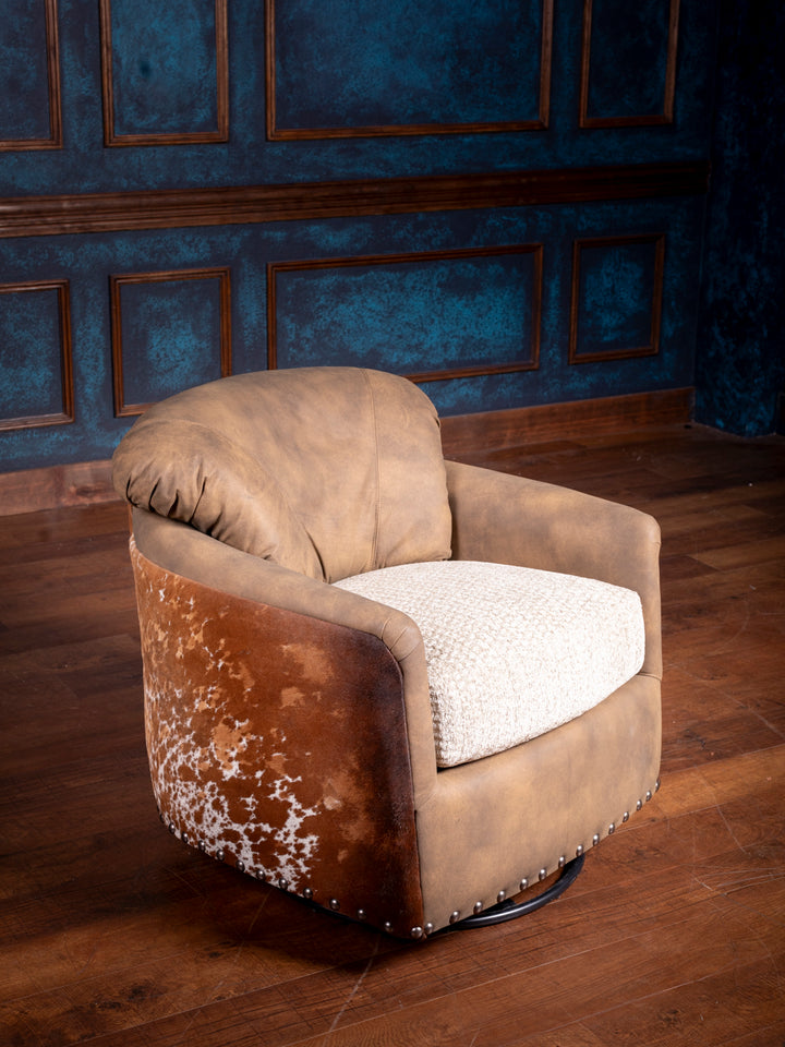 A brown leather swivel chair with visible wear and tear, placed in a room with blue paneling.