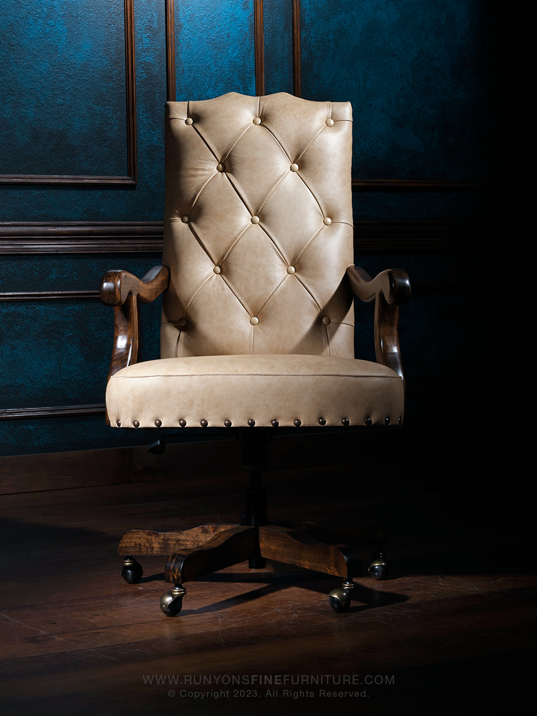 A tufted Scottsdale Western Desk Chair with West Vanilla leather and Crocodile Brown accents, featuring a textured backrest and button detailing, set against a blue background.