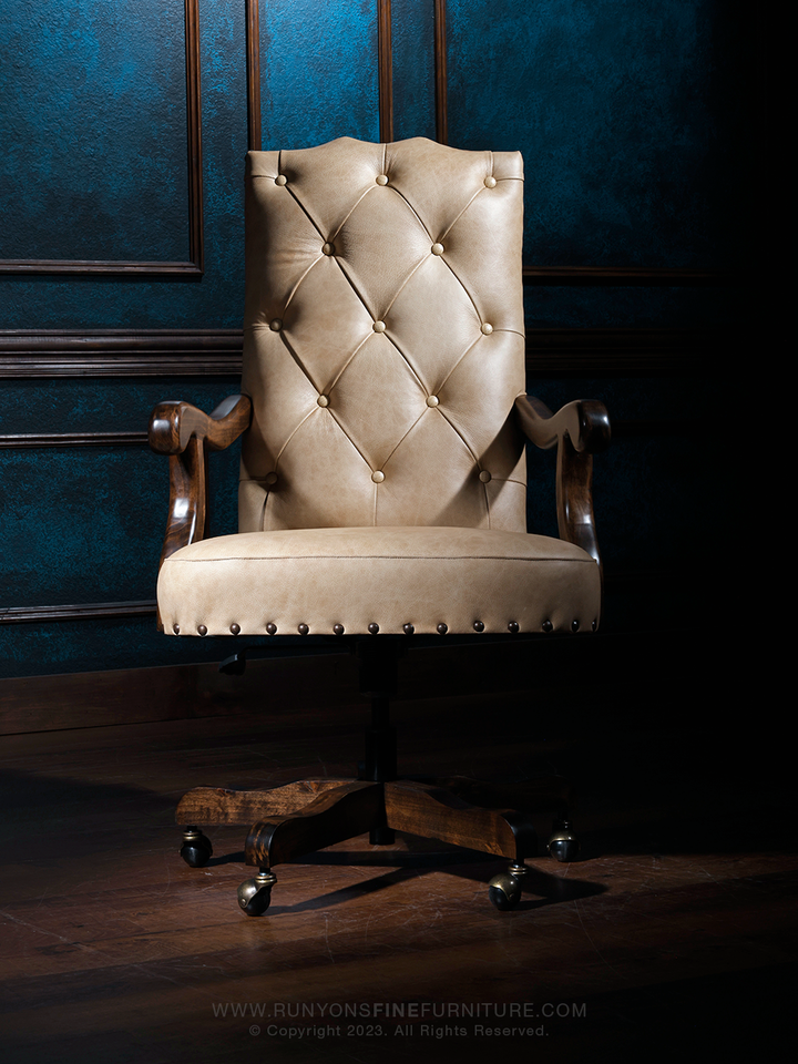 A tufted Scottsdale Western Desk Chair with West Vanilla leather and Crocodile Brown accents, featuring a textured backrest and button detailing, set against a blue background.