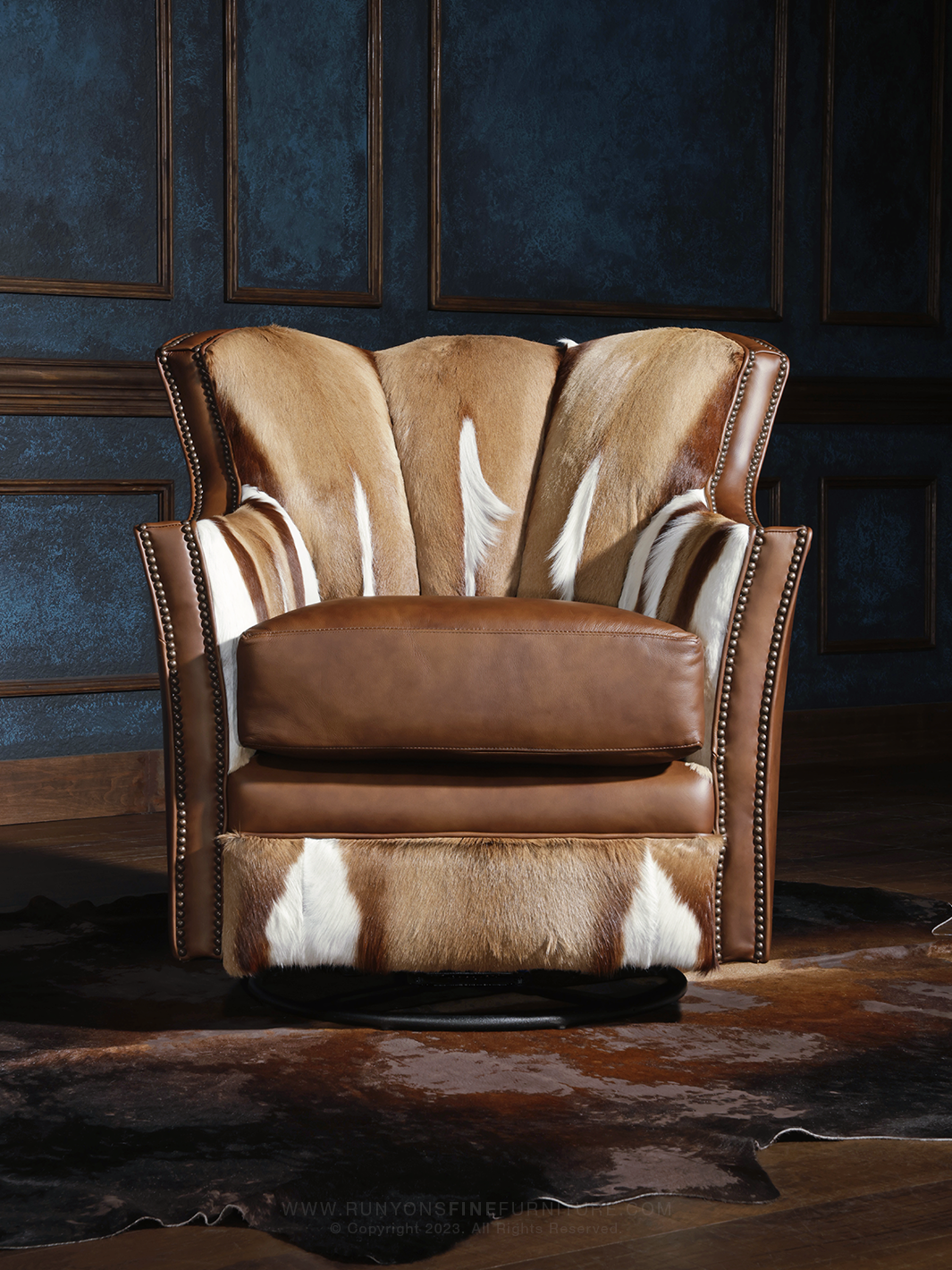 front view shot of brown italian leather swivel chair with authentic springbok hair on hide interior.
