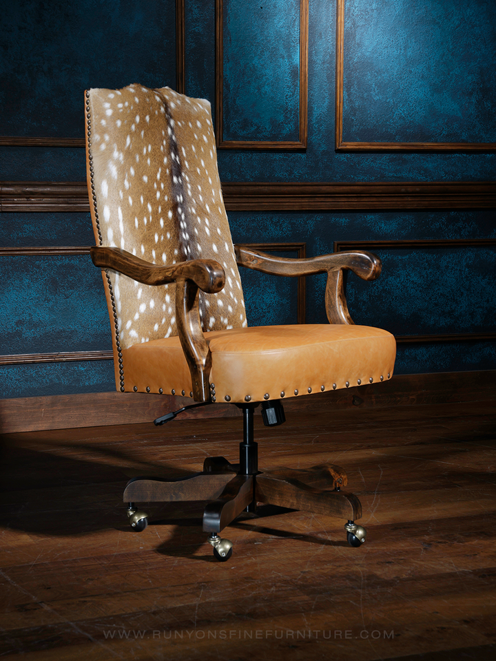 A brown leather desk chair with a tufted backrest and a five-point wheeled base, set against a dark blue textured background.