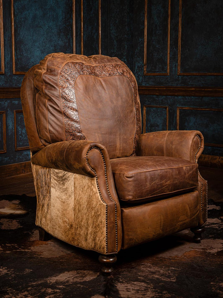 A brown leather recliner chair with visible cowhide patterns, situated in a room with dark panelled walls.