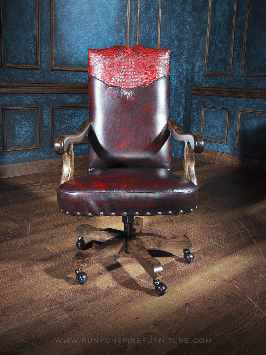 A chestnut brown executive desk chair with distressed red leather, featuring a wooden frame, armrests, and caster wheels.