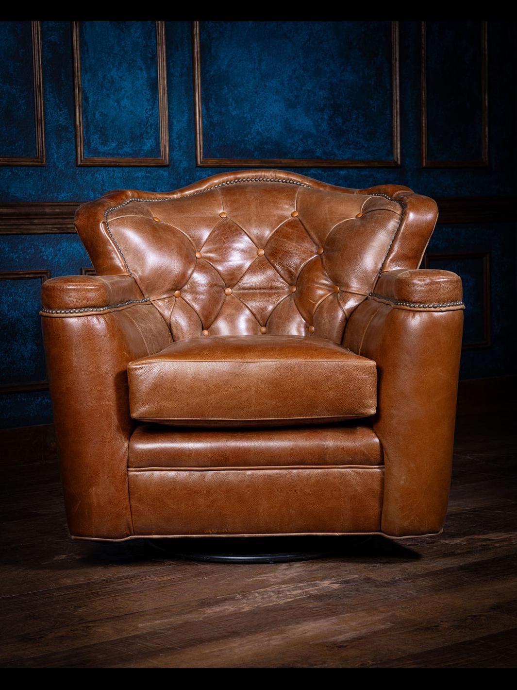 A tufted leather swivel chair with a brown color and detailed tufting, placed in a room with blue walls.