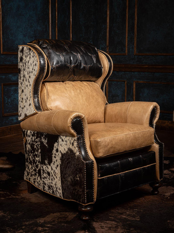 A tan longhorn embossed leather recliner chair with black accents and detailed stitching.