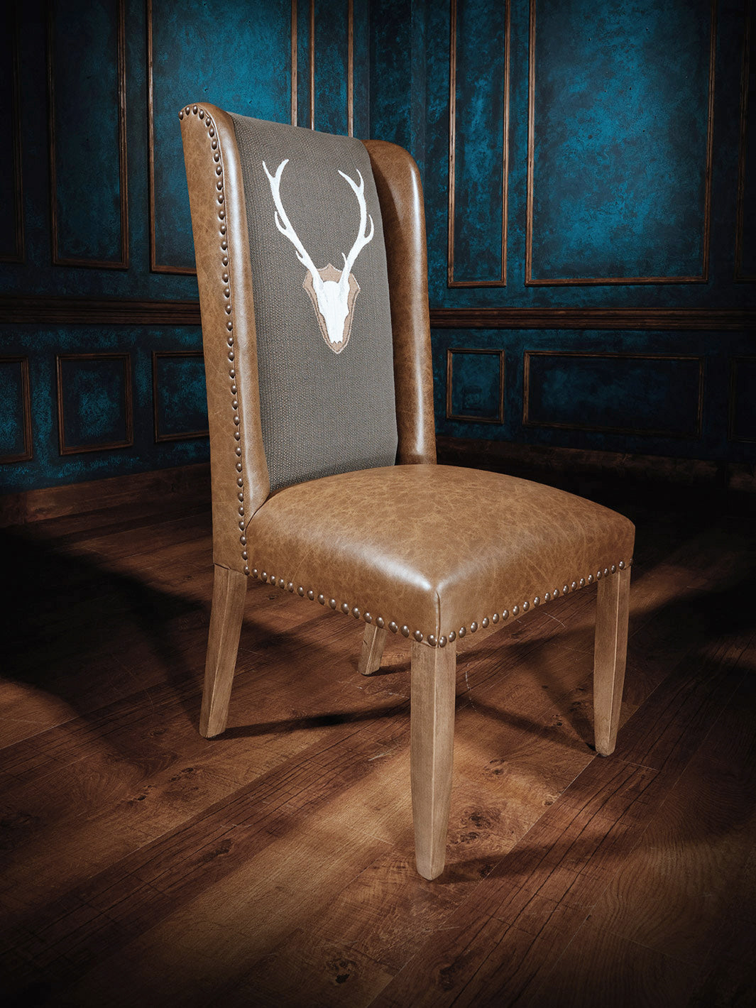 Manhattan Side Chair with Uncle Buck, featuring a distinctive deer head design on the backrest, ideal for rustic interior settings.