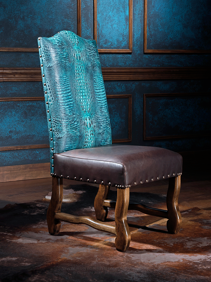 A luxurious leather dining chair with a dark brown seat and an embossed crocodile pattern on the backrest, featuring a wooden frame and studded detailing.