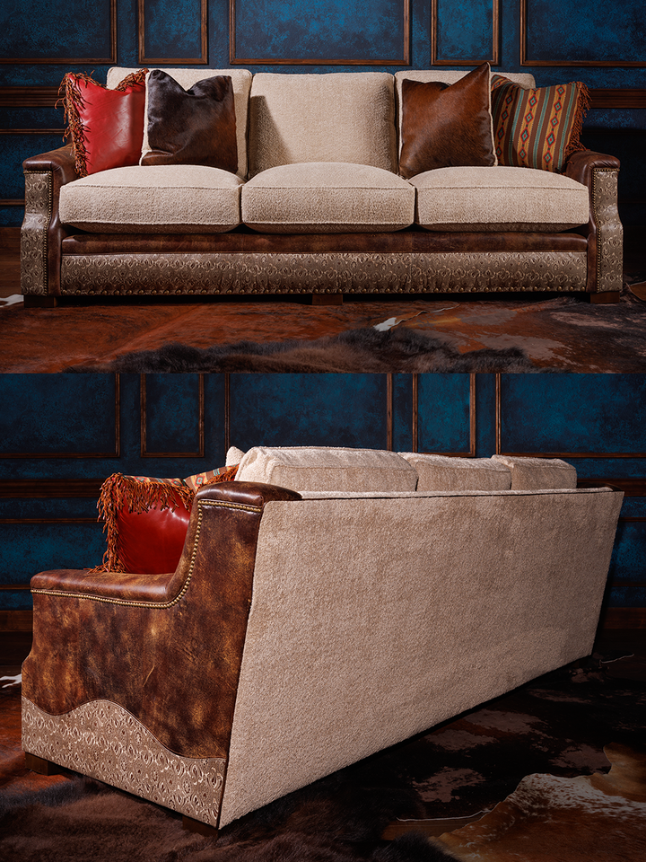 front and back view of western sofa with fabric cushions and fabric back and leather sides, sitting on hair on hide rug