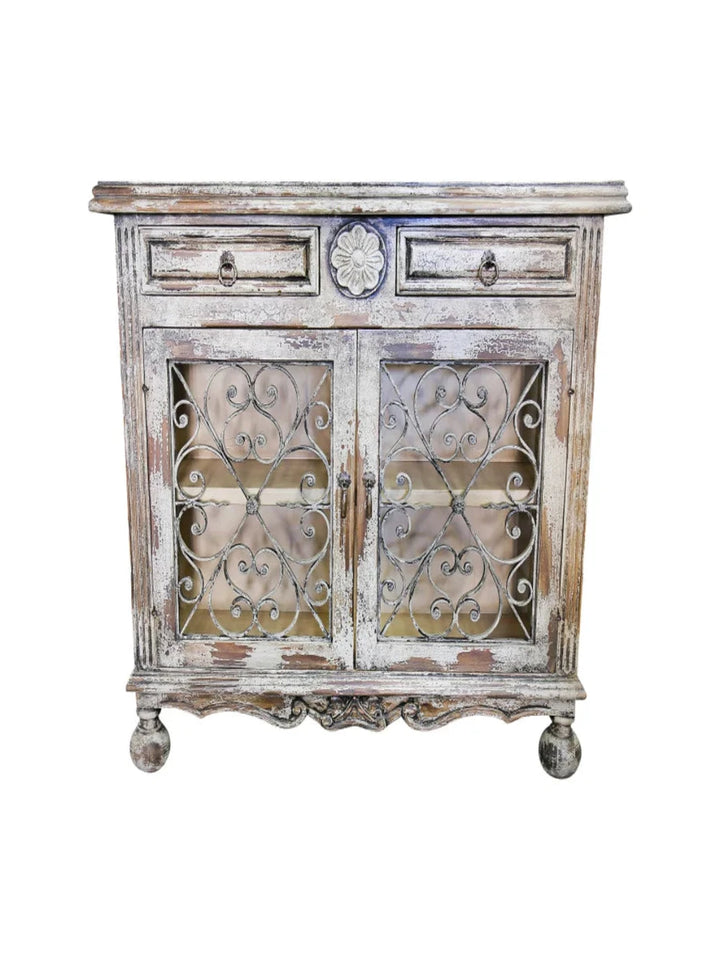 Vintage-style wooden cabinet with decorative metal doors on a white background