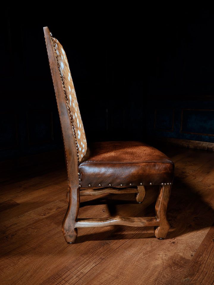 side view of axis deer hide side chair with burnished leather seat