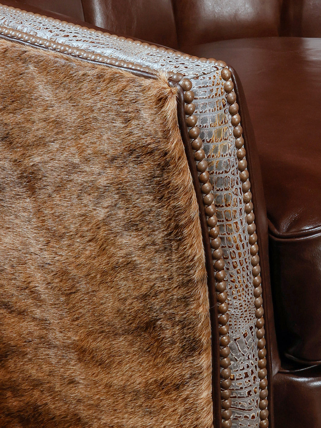 close view of the hide, croc, and nailheads