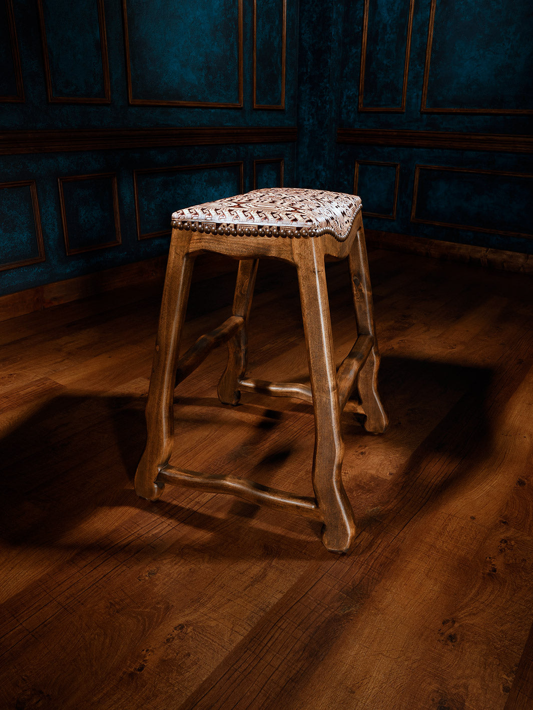 side view of western design leather barstool with no back and