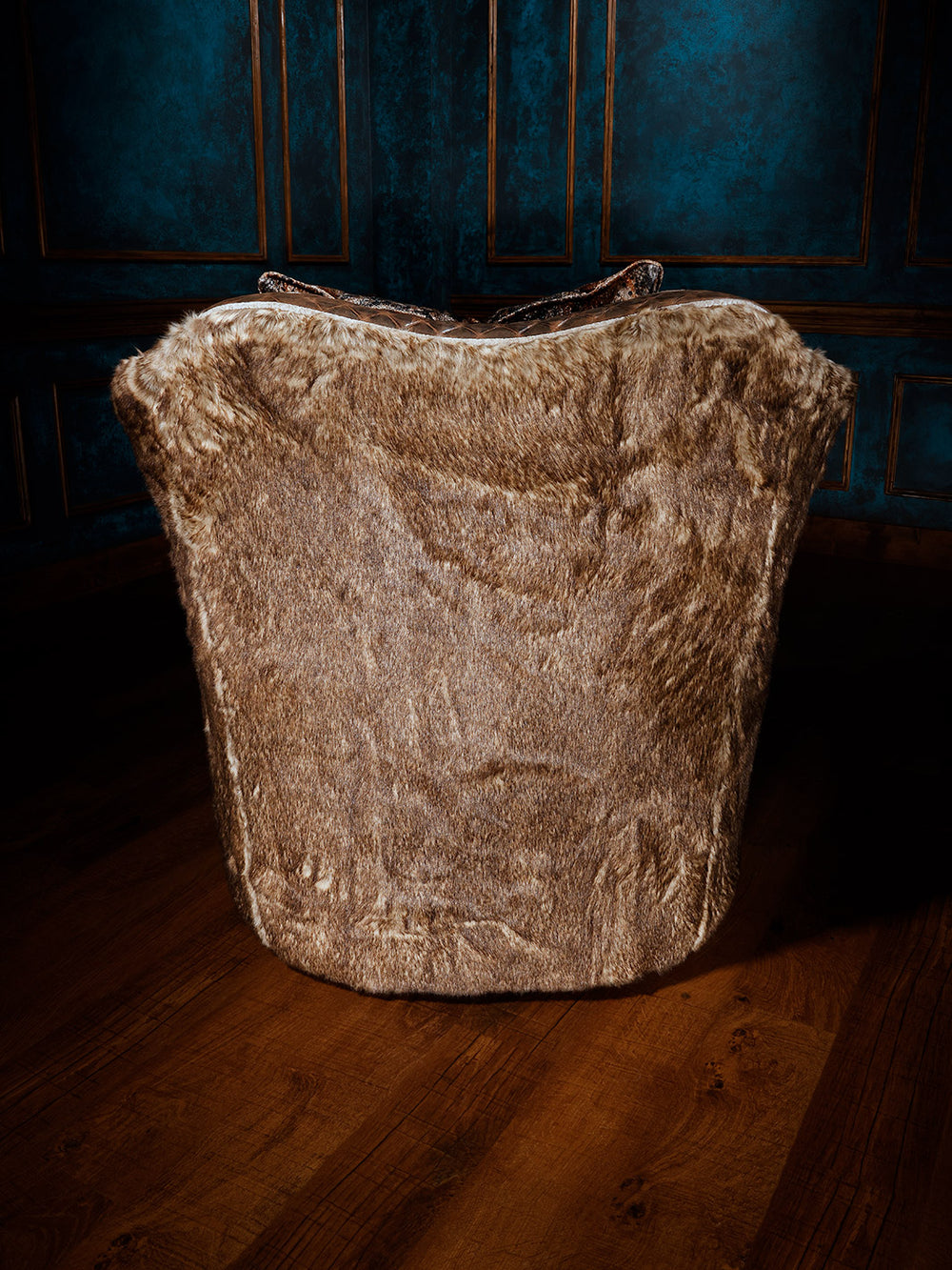 rear view of fabric and leather swivel chair with decorative pillow