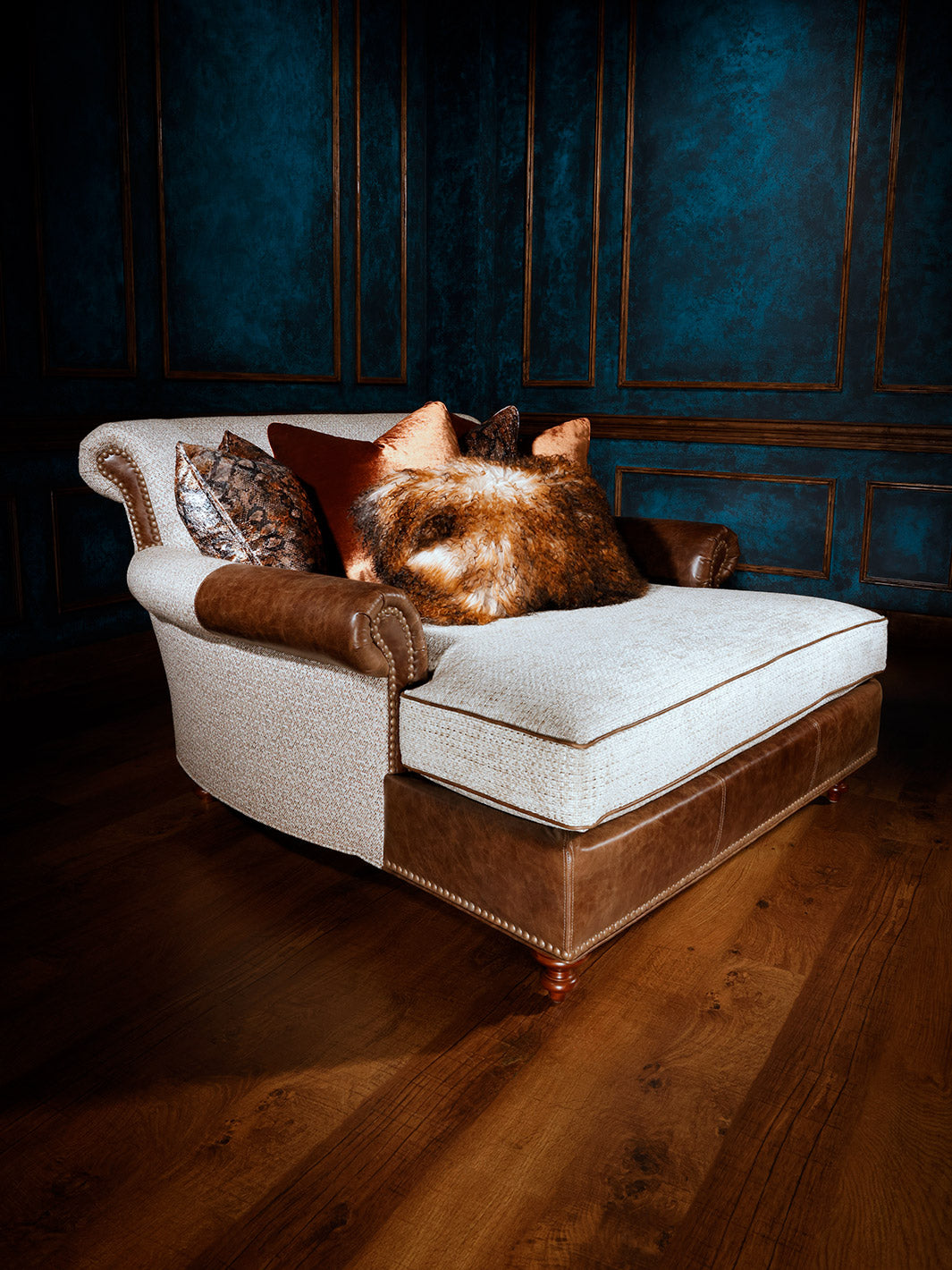 white fabric and brown leather chaise lounge