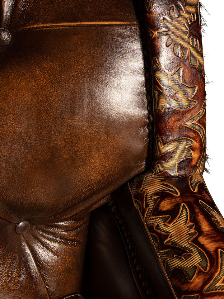 close up view of luxurious brown leather/cowhide tufted sofa