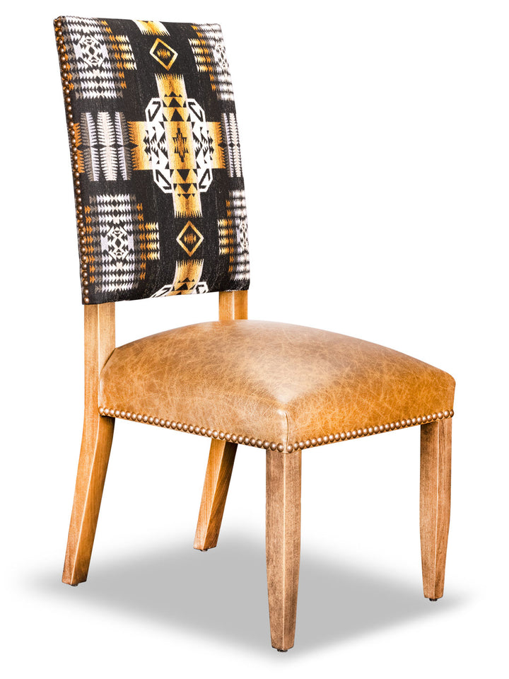 A Dakota Southwestern Style Dining Chair with a straight-back frame, driftwood finish, and an Apache fabric design on the backrest, featuring a genuine leather seat.