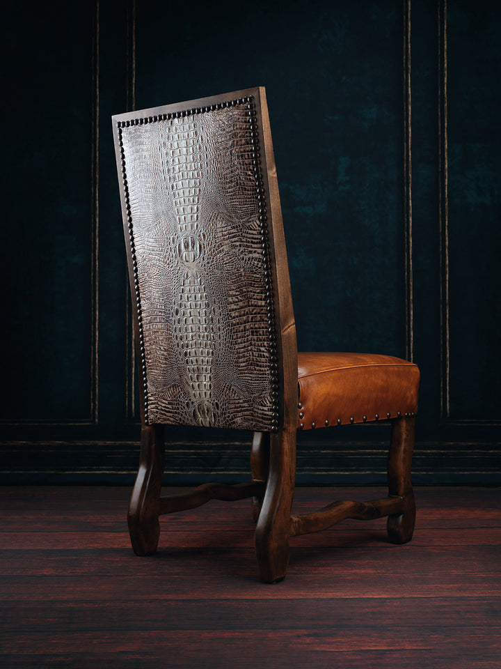A brown leather dining chair with a textured backrest and a smooth seat, featuring a dark wood frame and White Gator backing.