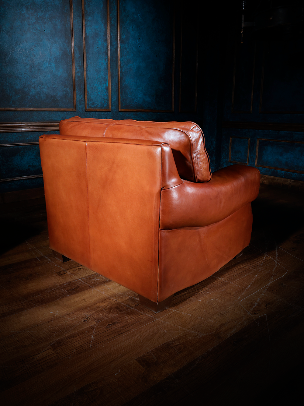 Rear view of the Western leather accent chair, showcasing its seamless leather upholstery and clean lines. The deep seat and wide backrest offer both comfort and a refined Southwestern aesthetic.