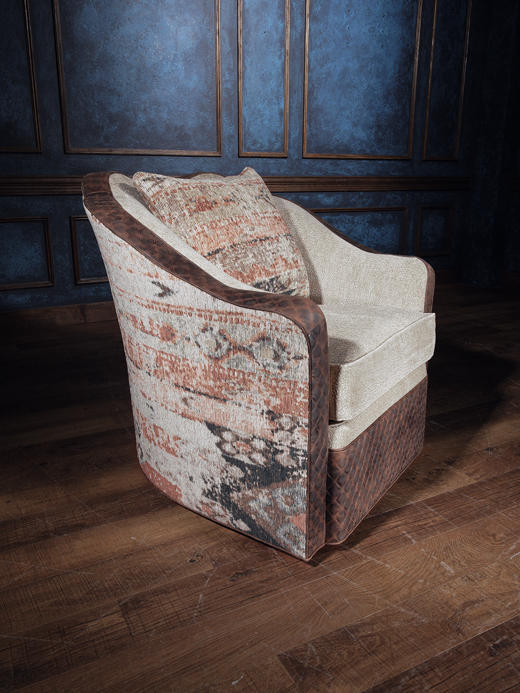 A rustic elegant upholstered swivel chair with a multicolored pattern, featuring a wooden frame and fabric seating.