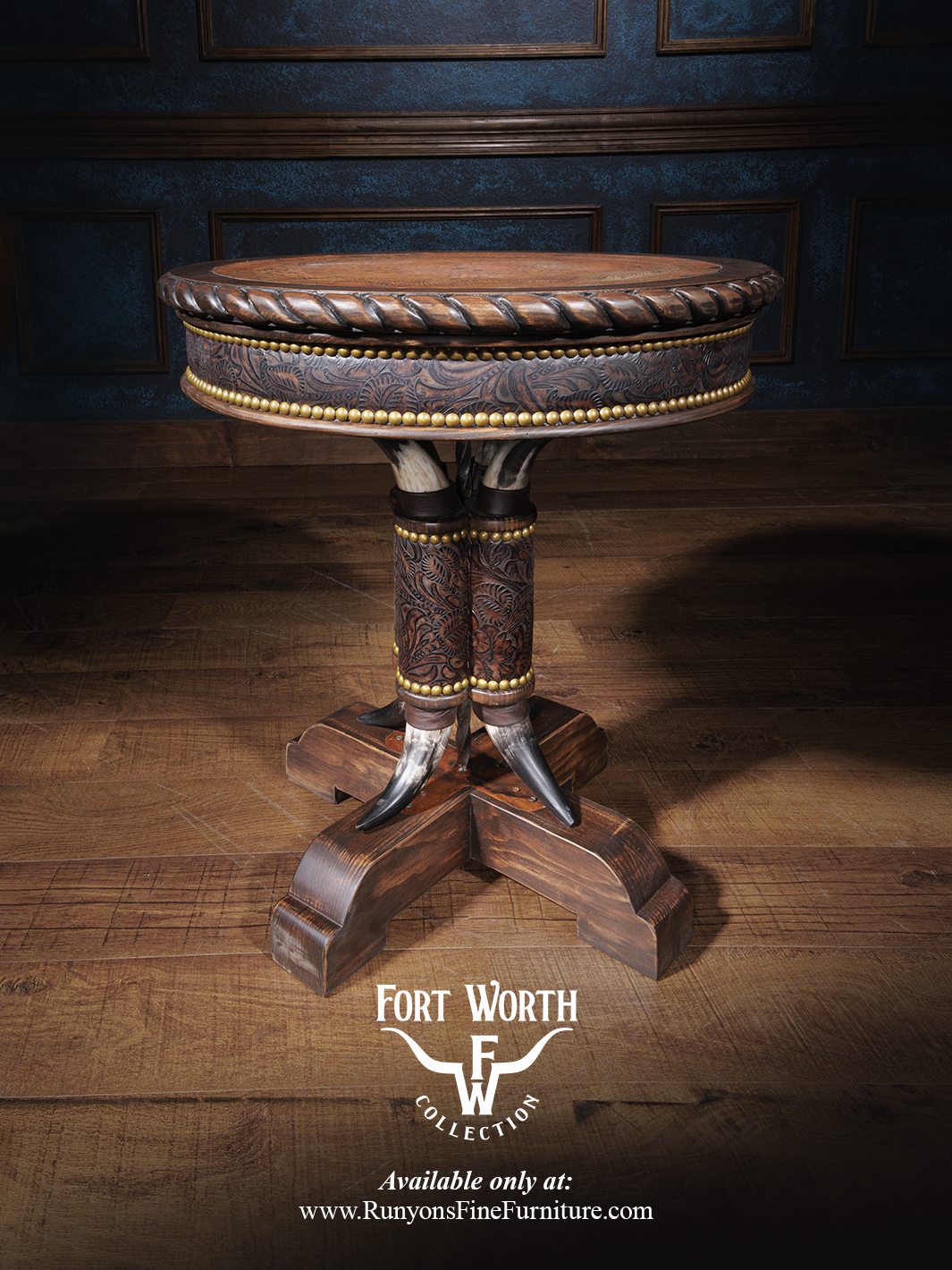 A handcrafted Western Steer Pedestal End Table with a copper inlay center, leather detailing, and wooden carvings, set against a blue wall and wooden floor background.