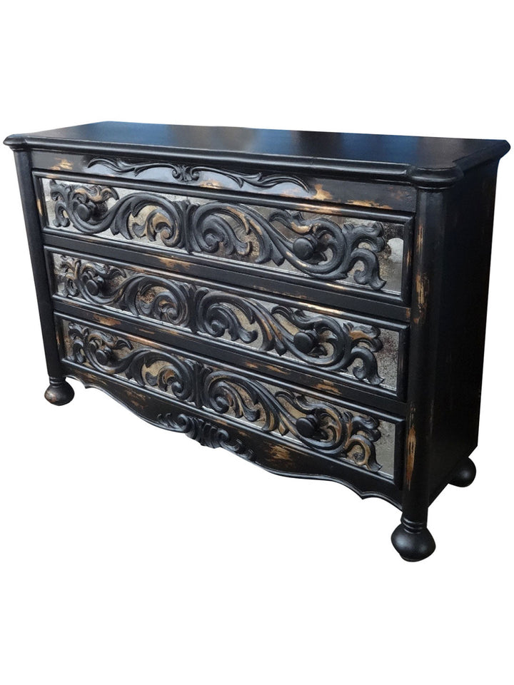 A hand-painted wooden dresser with intricate wood grain patterns and floral motifs in a classic design.