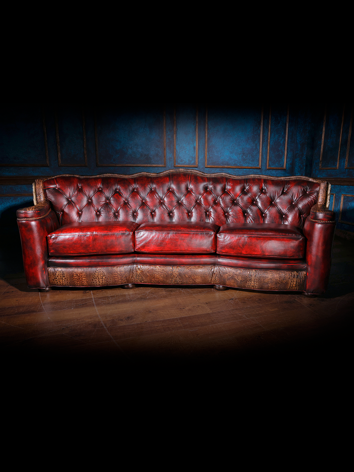 front view of red leather tufted sofa